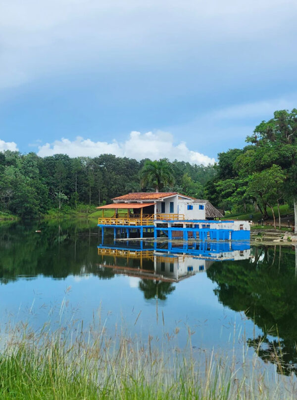A floating cottage on a lake.
